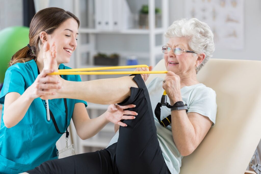elderly patient performing resistance training to strengthen legs